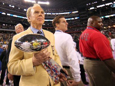 Roger Staubach presents the Vince Lombardi Trophy after Super Bowl XLV between the Green Bay...