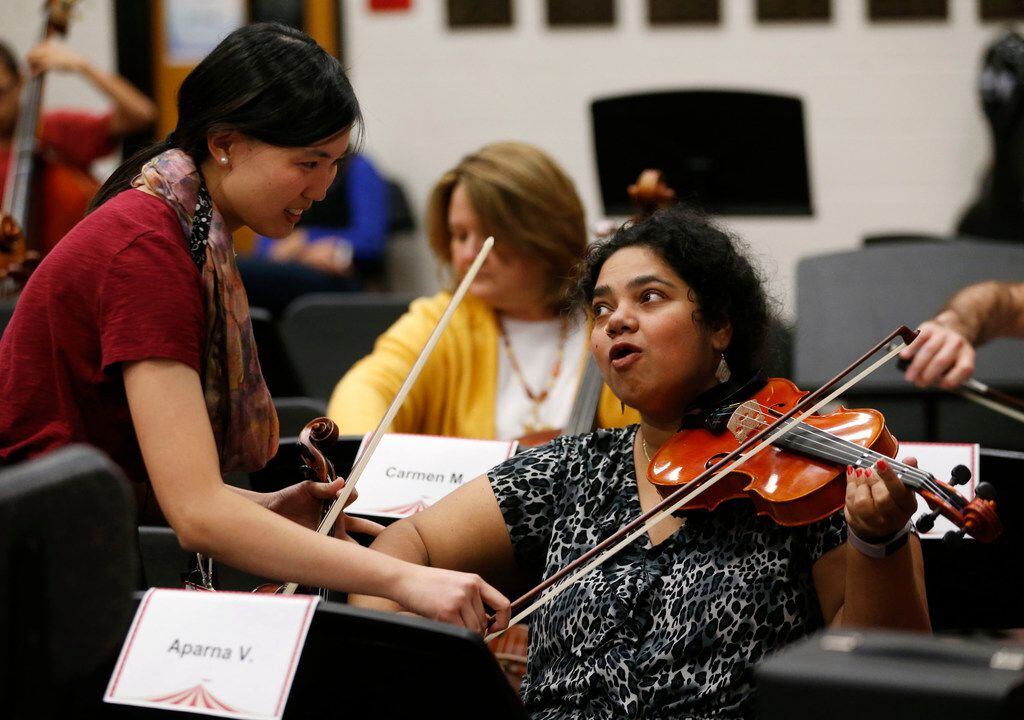 Aparna Viswanathan gets help from Frisco Liberty High School's assistant director of...