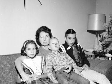 Marie Tippit and her children, Brenda, Curtis and Allan, the day after J.D. Tippit was shot...