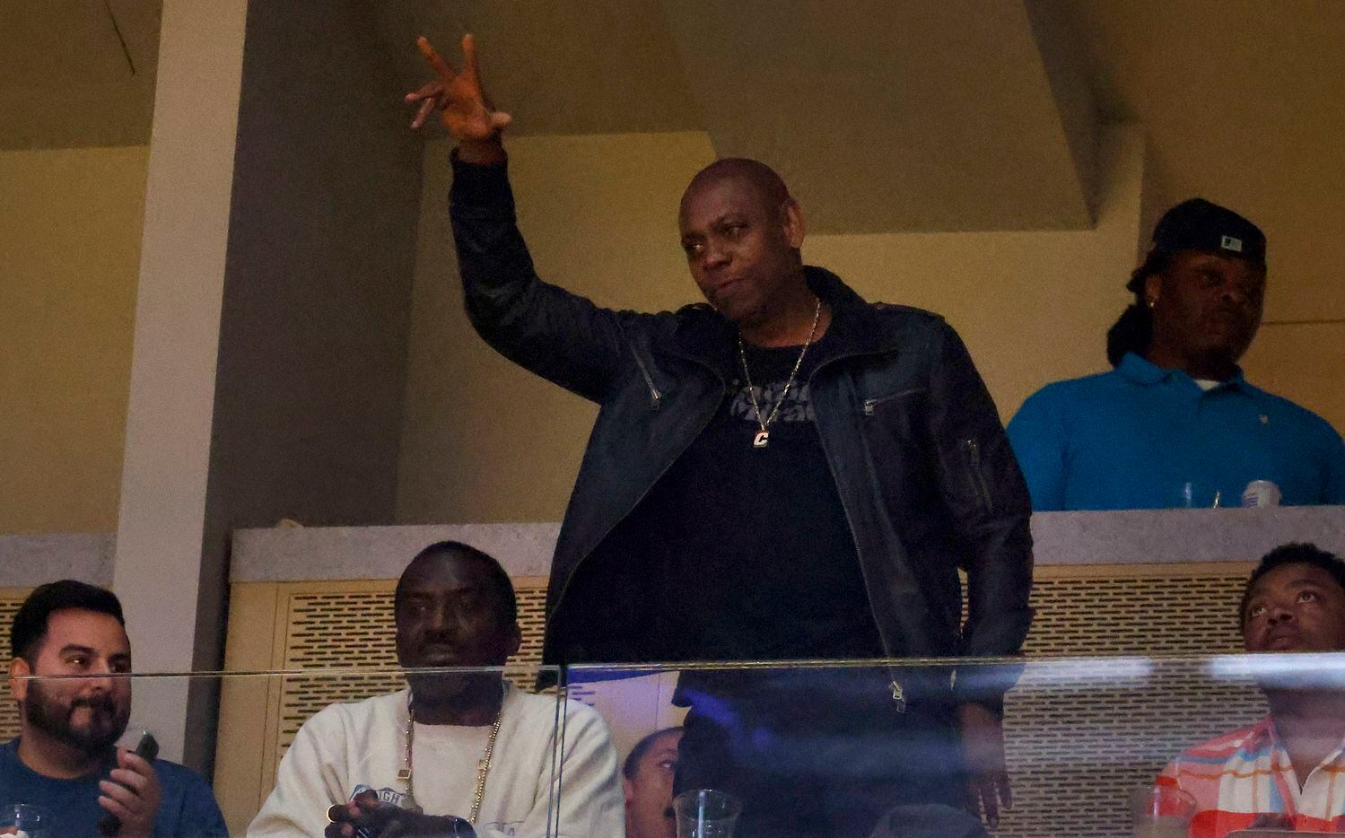 Comedian Dave Chappelle waves to Golden State Warriors fans as he’s introduced during Game 5...