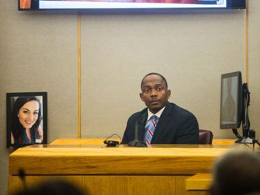 Dallas homicide detective Eric Barnes describes photos of Kristopher Love's tattoos during...
