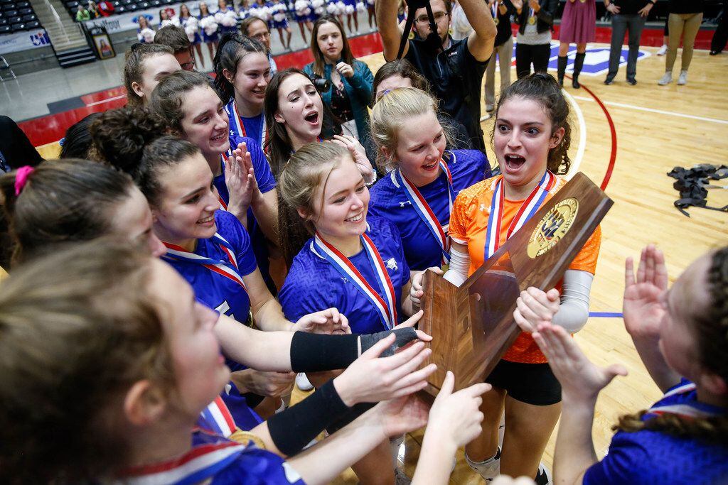 Trophy Club Byron Nelson Bobcats celebrate after winning the class 6A volleyball state final...