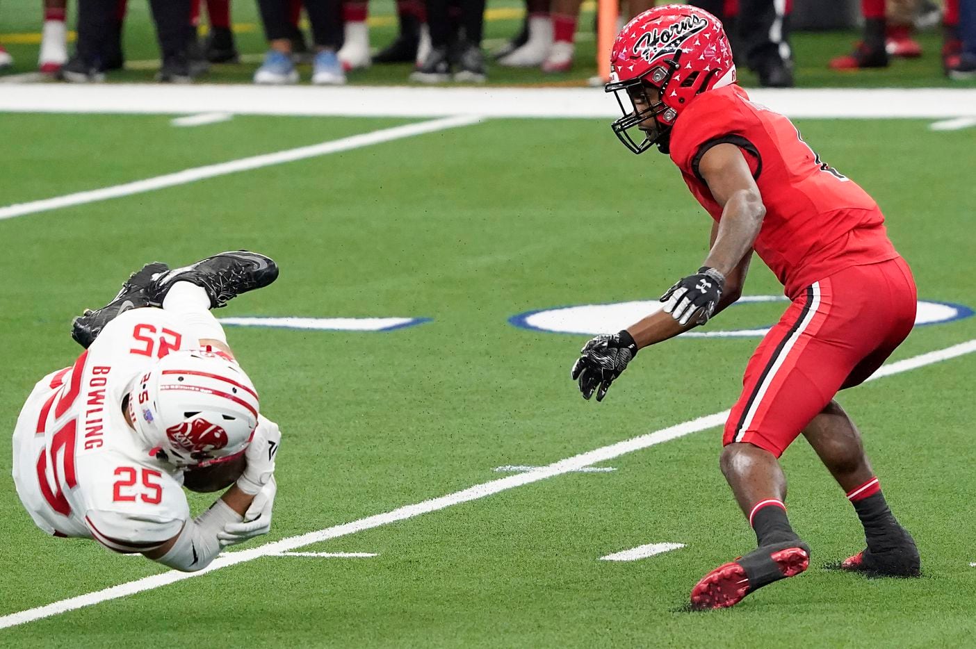Katy linebacker Shepherd Bowling (25) intercepts a pass intended for Cedar Hill wide receiver Anthony Thomas IV (1) during the first half of the Class 6A Division II state football championship game at AT&T Stadium on Saturday, Jan. 16, 2021, in Arlington, Texas.