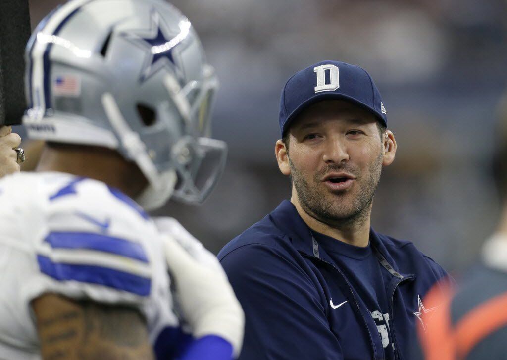 In this Sunday, Jan. 3, 2016 photo, Dallas Cowboys' Tony Romo talks with teammates on the...