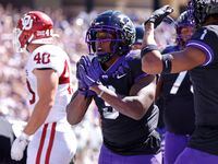 TCU running back Emari Demercado (3) celebrates with teammates after running for a touchdown...