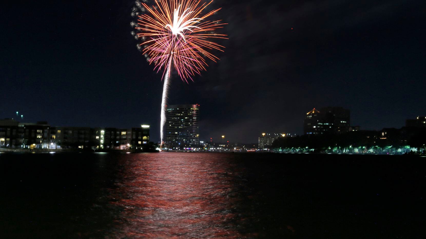 Fireworks light the night sky over Lake Carolyn in Irving in this file photo. Irving's Fourth of July celebration will return this year with a parade, fireworks and live music.