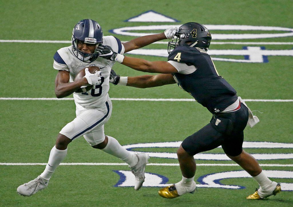Frisco Lone Star's Marvin Mims (18) tries to get away from The Colony's Jaxon Gibbs (4)...