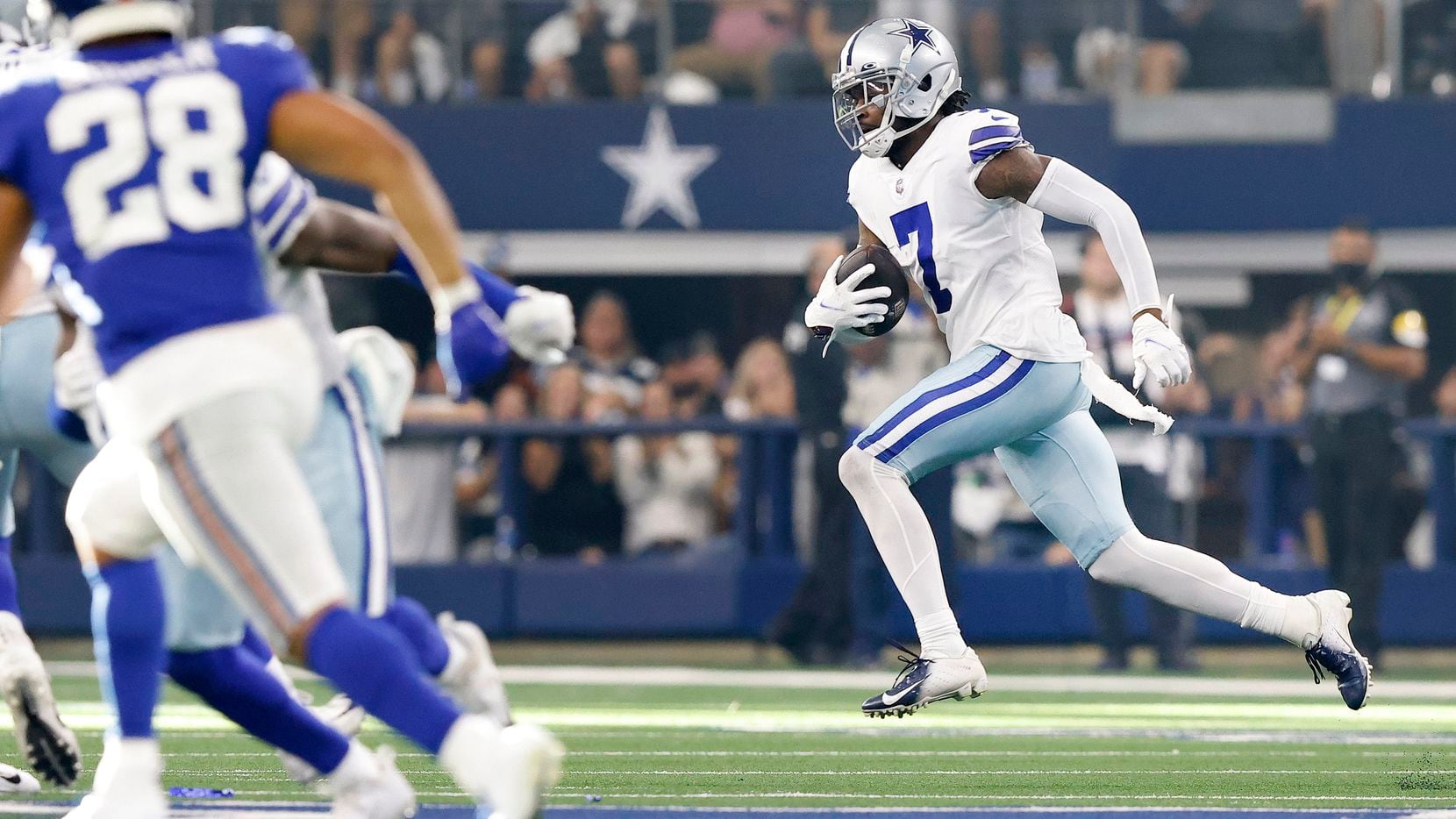 Dallas Cowboys cornerback Trevon Diggs (7)  returns a third quarter interception against the...