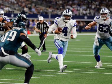 Dallas Cowboys quarterback Dak Prescott (4) scrambles to the two-yard-line during the second...