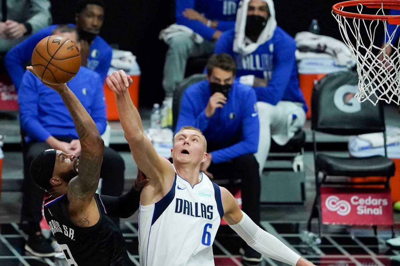 Dallas Mavericks center Kristaps Porzingis (6) blocks a shot by LA Clippers forward Marcus Morris Sr. (8) during the second half of an NBA playoff basketball game at Staples Center on Tuesday, May 25, 2021, in Los Angeles.