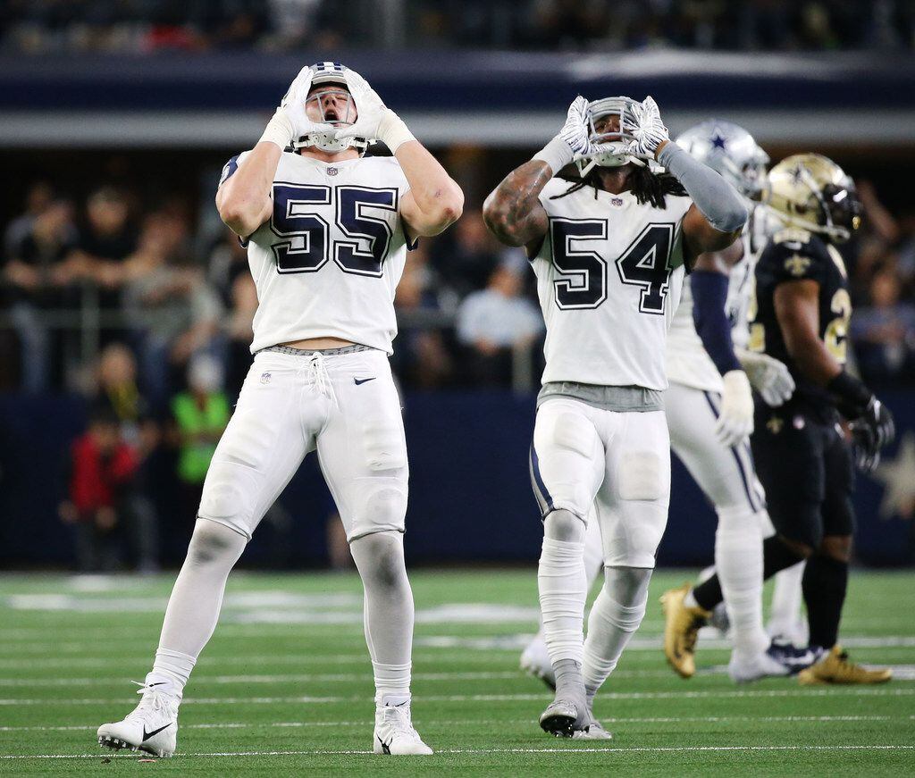 Dallas Cowboys outside linebacker Leighton Vander Esch (55) and Dallas Cowboys middle linebacker Jaylon Smith (54) celebrate after a tackle in the fourth period at AT&T Stadium in Arlington, Texas on Thursday, Nov. 29, 2018. The Dallas Cowboys beat the New Orleans Saints 13-10. (Rose Baca/The Dallas Morning News)