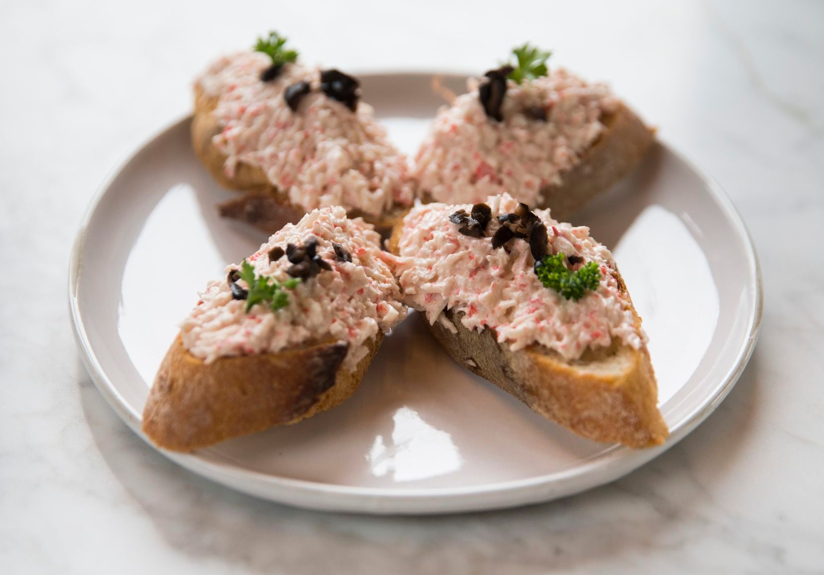 "Txaka," or imitation crab salad on baguette slices, at Sketches of Spain 