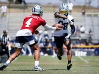 Dallas Cowboys wide receiver CeeDee Lamb (88) takes a hand off from quarterback Dak Prescott...