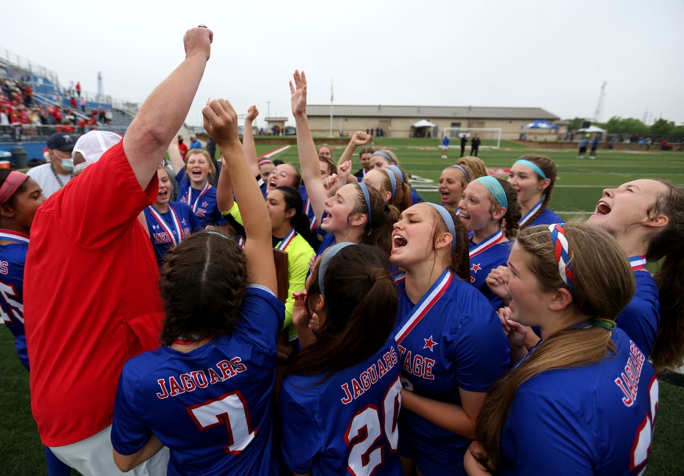 Midlothian Heritage head coach Gerald Slovacek cheers with his players at their win over Calallen at their UIL 4A girls State championship soccer game at Birkelbach Field on April 16, 2021 in Georgetown, Texas.  (Thao Nguyen/Special Contributor)