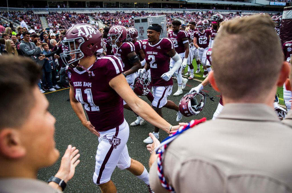 Texas A&M Aggies leave the field after warming up before a college football game between...