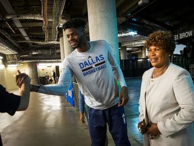 Dallas Mavericks forward Nerlens Noel shakes hands with a fan in the tunnel with his mother Dorcina before an NBA basketball game at American Airlines Center on Friday, March 10, 2017, in Dallas. (Smiley N. Pool/The Dallas Morning News)