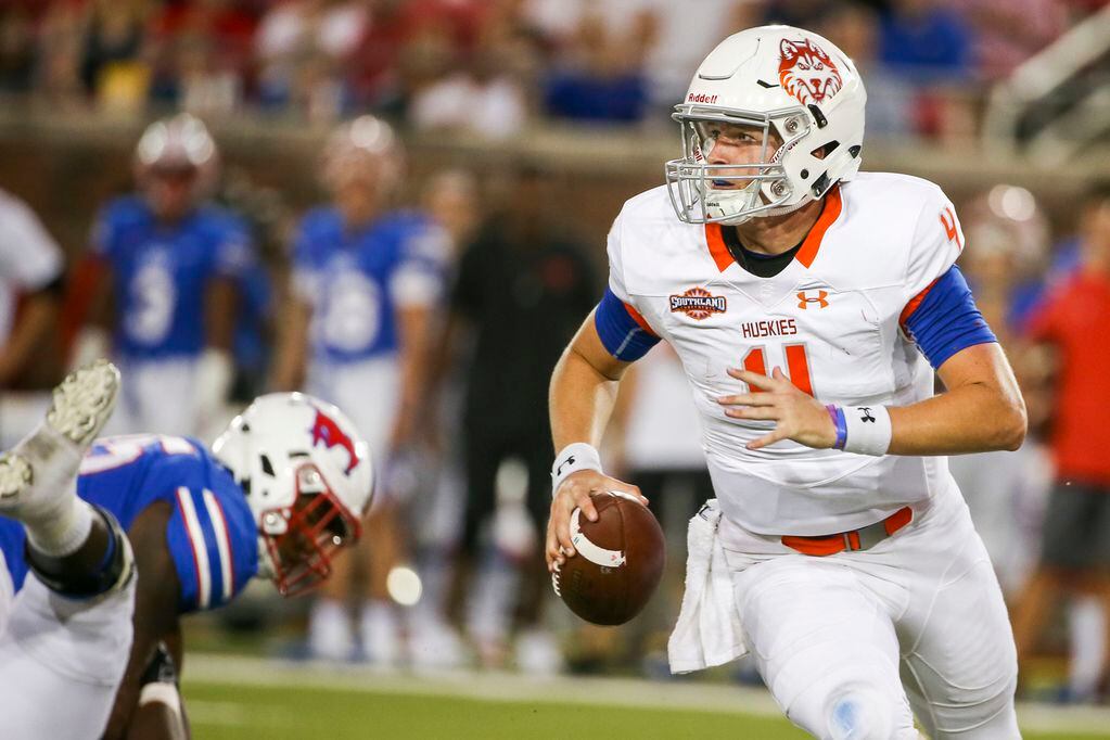 Houston Baptist Huskies quarterback Bailey Zappe (4) looks looks to pass during the first...