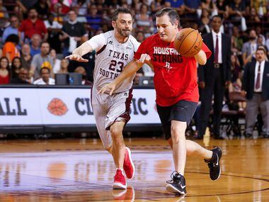 Senator Ted Cruz dribbles past Jimmy Kimmel during the Blobfish Basketball Classic and...