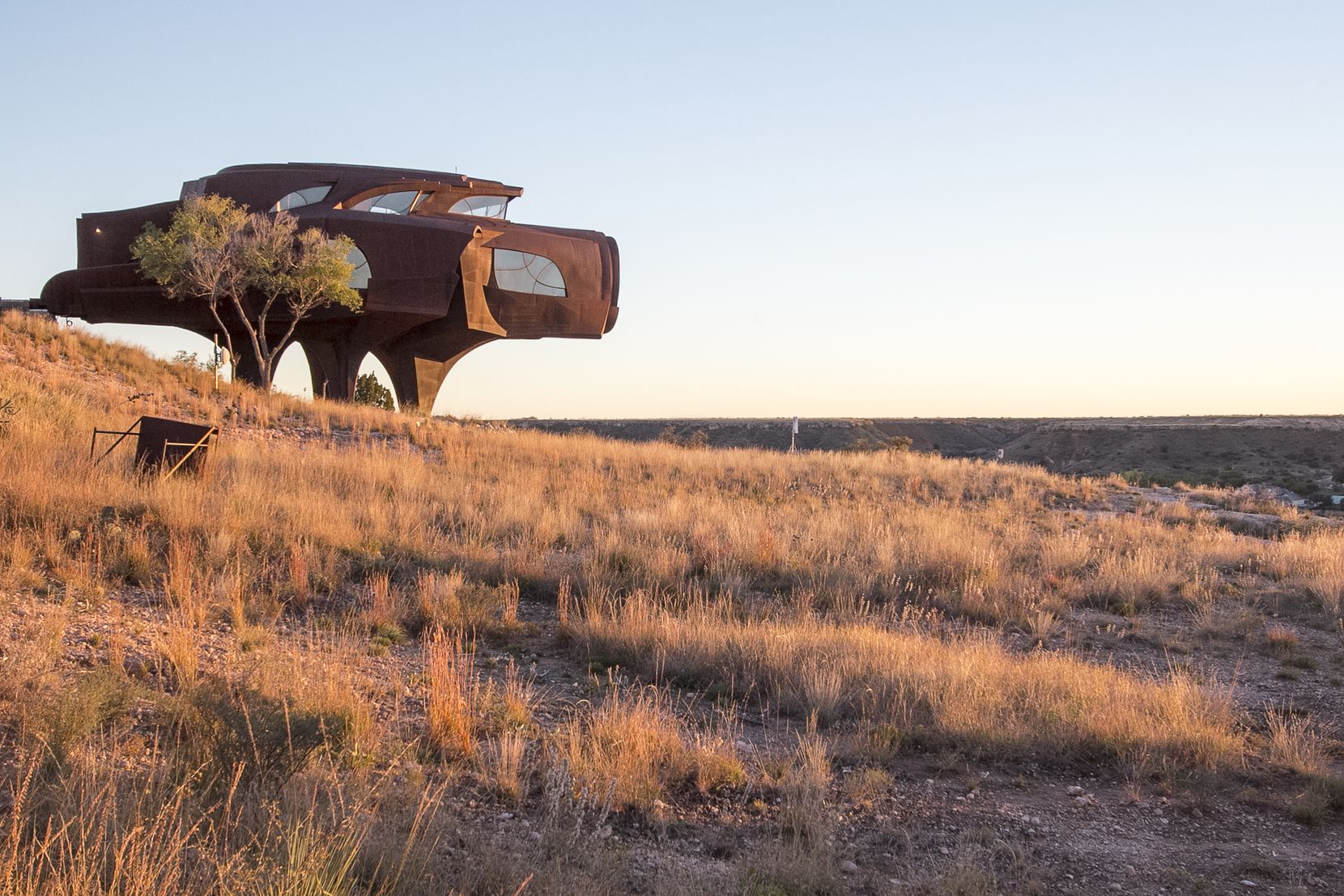 The sun sets on Robert Bruno's Steel House in Ransom Canyon, a residential community east of Lubbock, TX. 