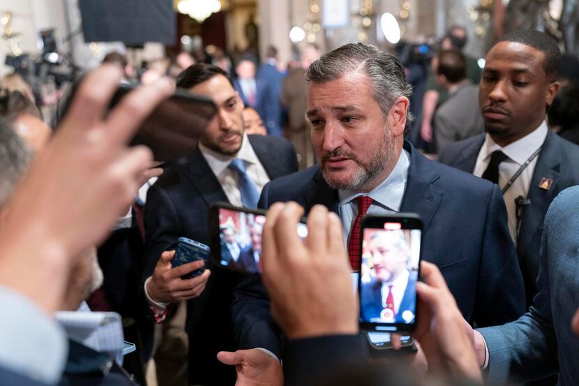 Sen. Ted Cruz, R-Texas, talks to reporters as he leaves the House Chamber after President...