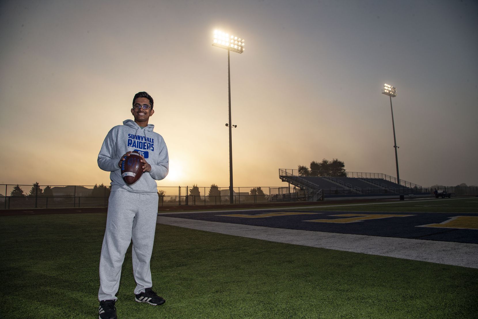 Sunnyvale High School sophomore Ryan Mathew, the football team manager, poses for a photo...