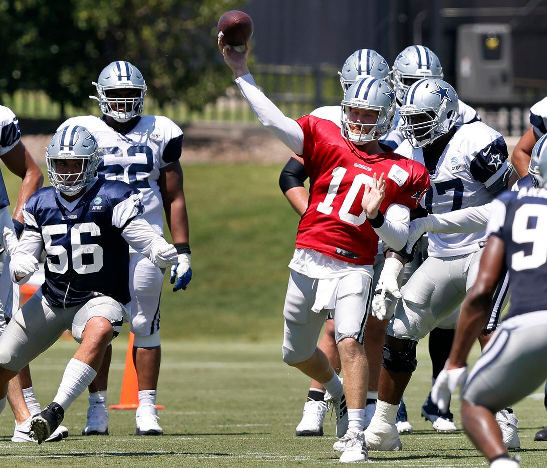 Dallas Cowboys quarterback Cooper Rush (10) throws a pass during Training Camp practice at...