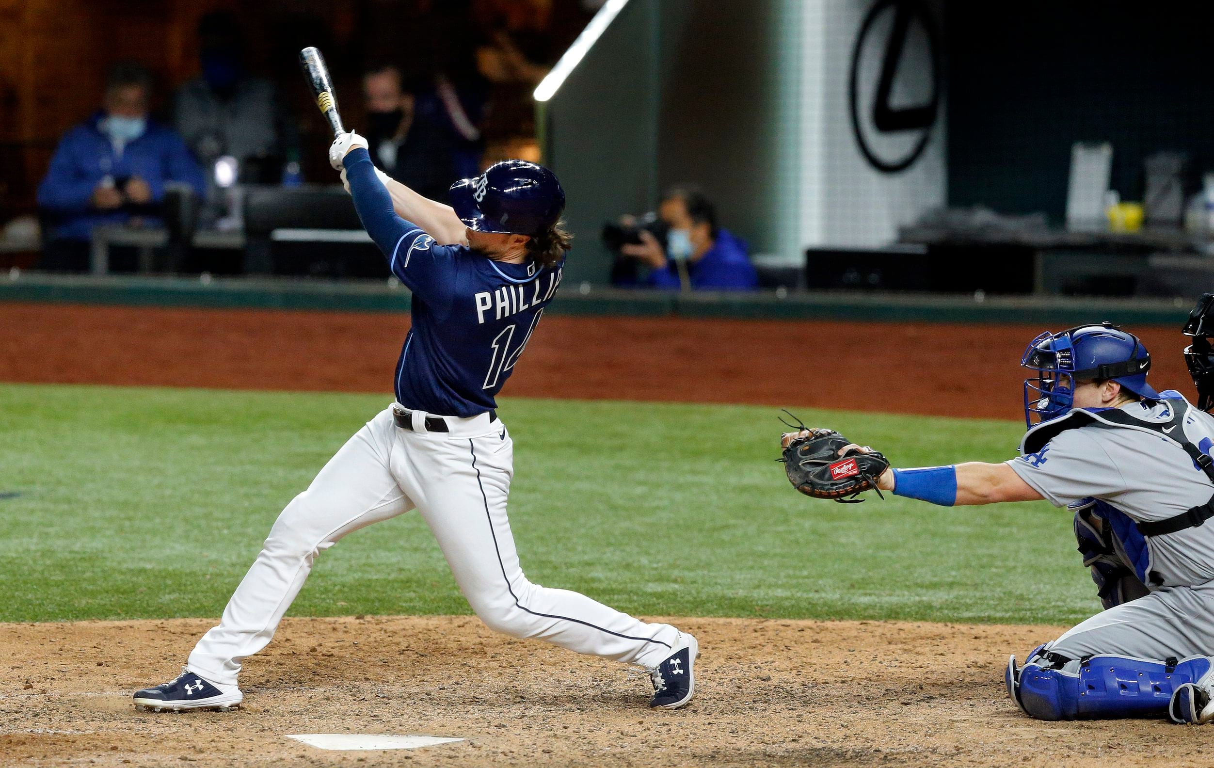 Photos: Randy Arozarena lays on home plate after game-winning run