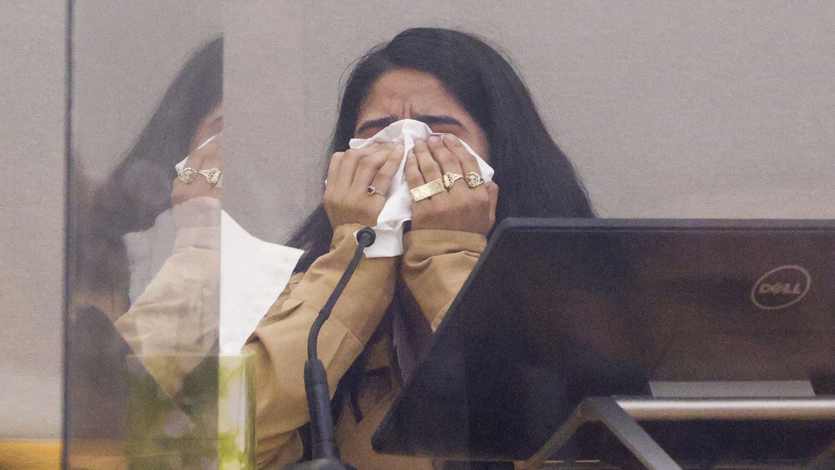 Yatziry Jaramillo, daughter of Jaime Jaramillo, wipes away tears while testifying during the...