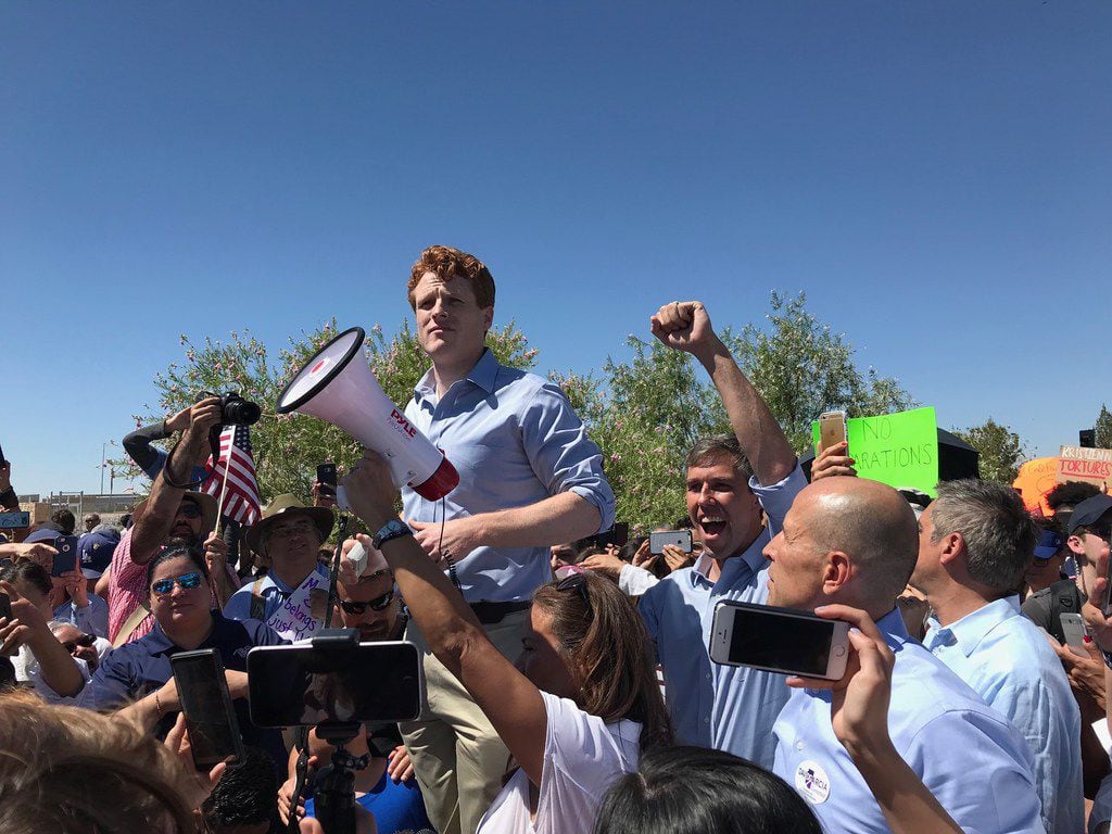 U.S. Rep. Joe Kennedy III, D-Mass., joined protesters near Tornillo, Texas, to protest Trump's immigration policies. Next to him is U.S. Rep. Beto O'Rourke, raising his arm. Outraged over the Trump administration's policy of  splitting up families entering the country illegally, protesters marched Sunday, June 17, 2018 to a shelter where children are being held outside this tiny farming community south of El Paso.