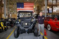 Massimo Group CEO David Shan stands next to his company's T-Boss 1000 utility vehicle at its...