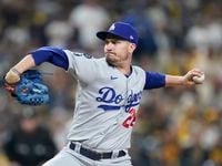 Los Angeles Dodgers relief pitcher Andrew Heaney works against a San Diego Padres batter...