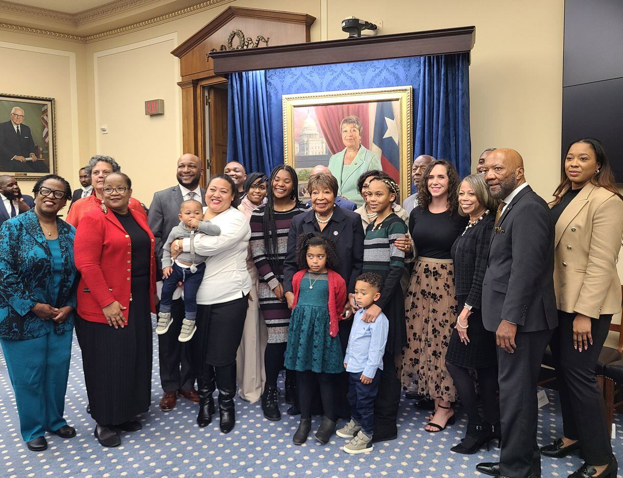 Rep. Eddie Bernice Johnson, D-Dallas, poses with family and friends in front of her official...