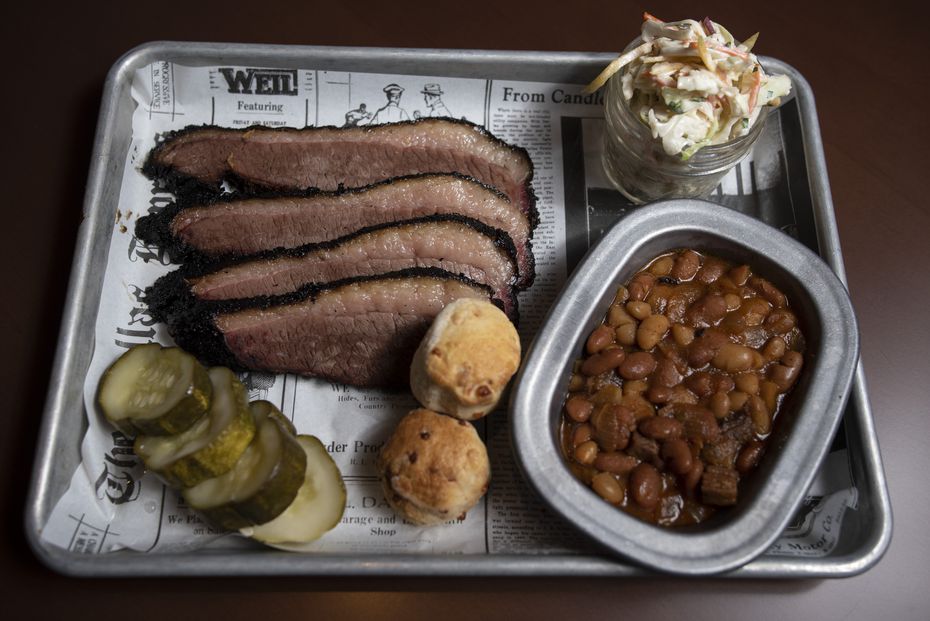 Sliced brisket with burnt ends pit beans, signature slaw and cheddar biscuits from Seely's...