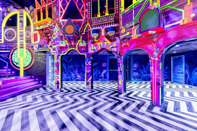 Meow Wolf's Neon Kingdom intrigues visitors with its otherworldly bright colors and unusual,...