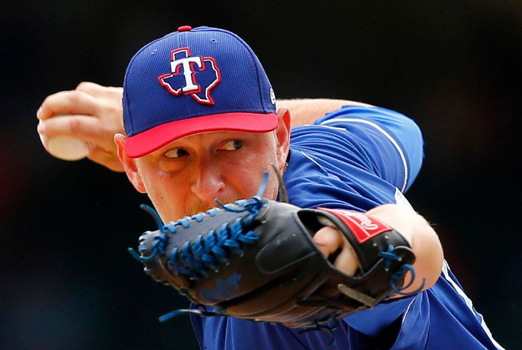 Texas Rangers relief pitcher Austin Bibens-Dirkx throws against the Kansas City Royals...