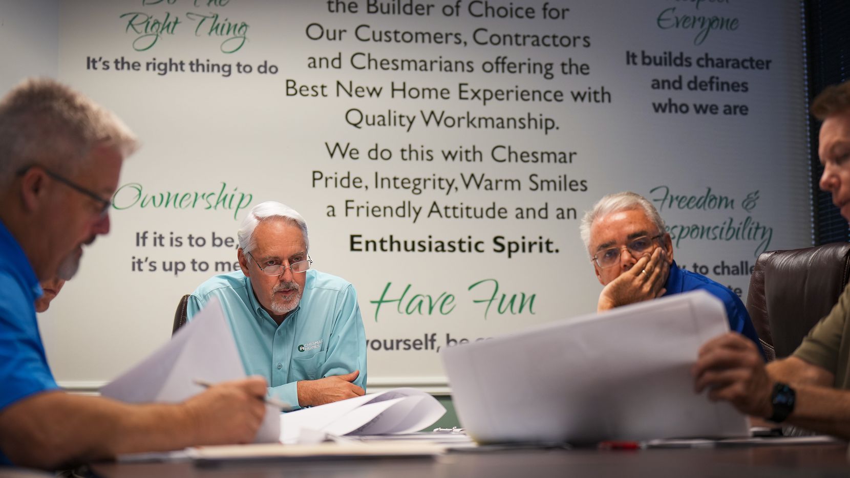 Reminders of the company’s mission cover the wall of a conference room as DFW president...