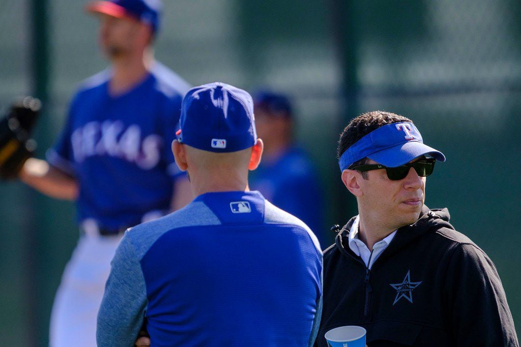 Texas Rangers general manager Jon Daniels (right) watches a bullpen session with manager Chris Woodward during a spring training workout at the team's training facility on Sunday, Feb. 17, 2019, in Surprise, Ariz.. (Smiley N. Pool/The Dallas Morning News)