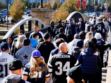 Dallas Cowboys and Las Vegas Raiders fans arrive for the Thanksgiving Day game at AT&T...