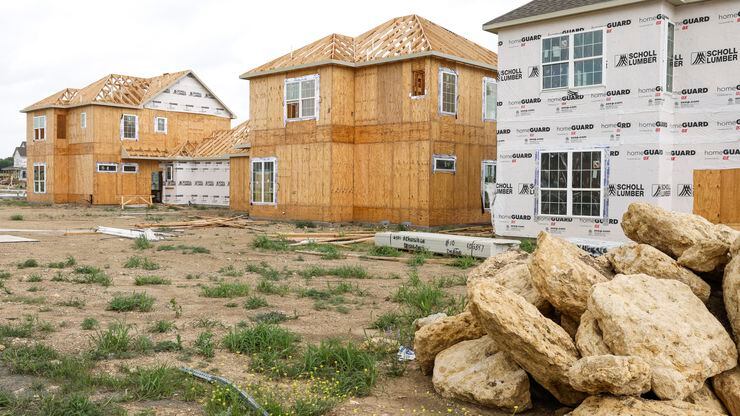 Single-family rental houses under construction at the Residences at Rayzor Ranch in Denton...