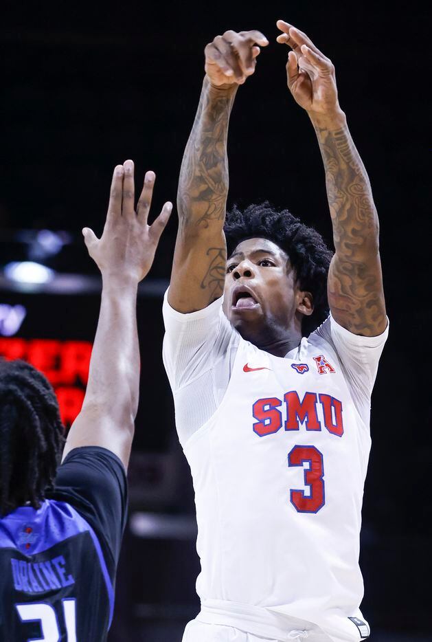Southern Methodist Mustangs guard Kendric Davis (3) shoots a three pointer while defended by...