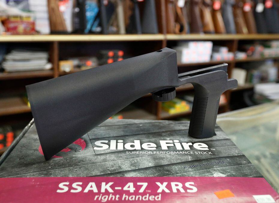 A bump stock device, made by Slide Fire, fits on a semi-automatic rifle to increase the...