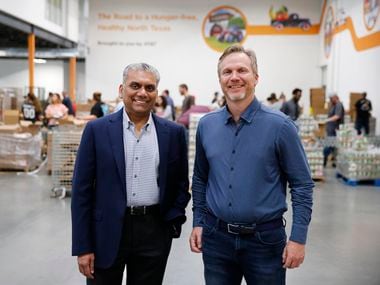 Anurag Jain, chairman of the North Texas Food Bank, is shown with Shiftsmart president Patrick Brandt at North Texas Food Bank in Plano.