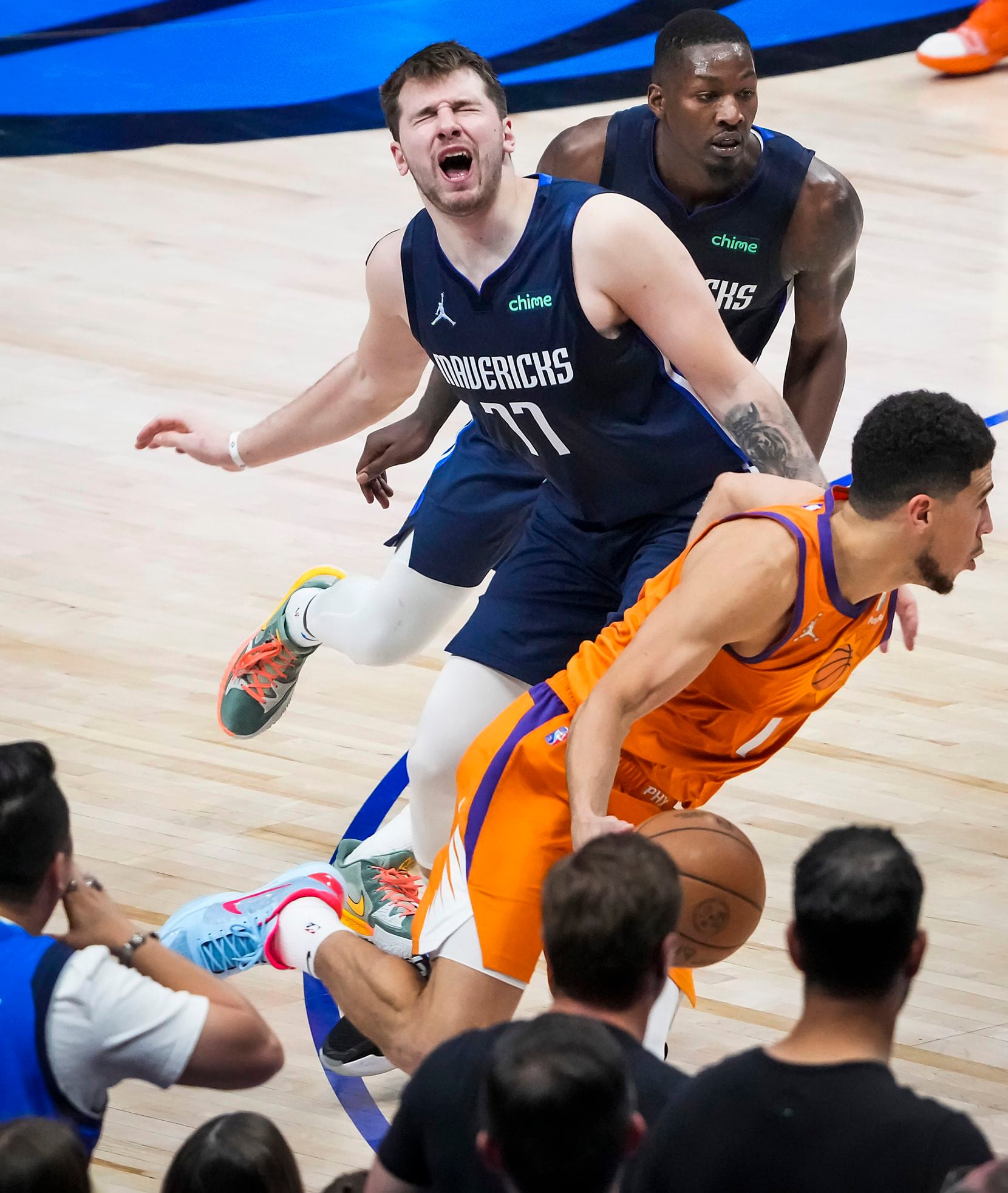 Dallas Mavericks guard Luka Doncic (77) reacts after being fouled by Phoenix Suns guard...