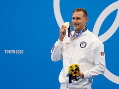 USA’s Caeleb Dressel poses for photographers after  receiving his gold medal during the...