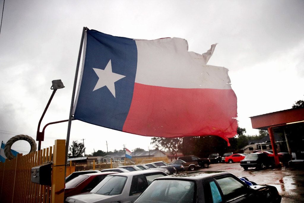 Wind from Hurricane Harvey batters a Texas flag on August 26, 2017 in Houston, Texas. Harvey, which made landfall north of Corpus Christi late last night, is expected to dump upwards to 40 inches of rain in Texas over the next couple of days.