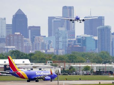 A Southwest Airlines 737 lands at Dallas Love Field on Tuesday, April 14, 2020, in Dallas.  (Smiley N. Pool/The Dallas Morning News)
