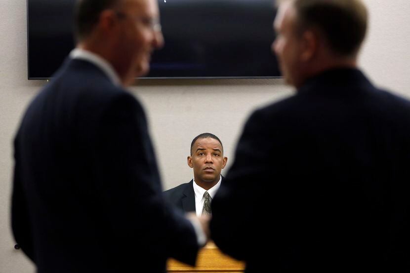 Texas Ranger David Armstrong waits for defense attorney Robert Rogers (left) and Assistant...