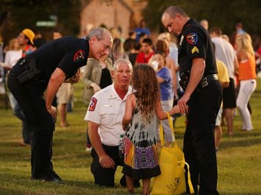 Plano Police Chief Greg Rushin (left), Plano Fire Chief Sam Greif (middle), and Plano police...