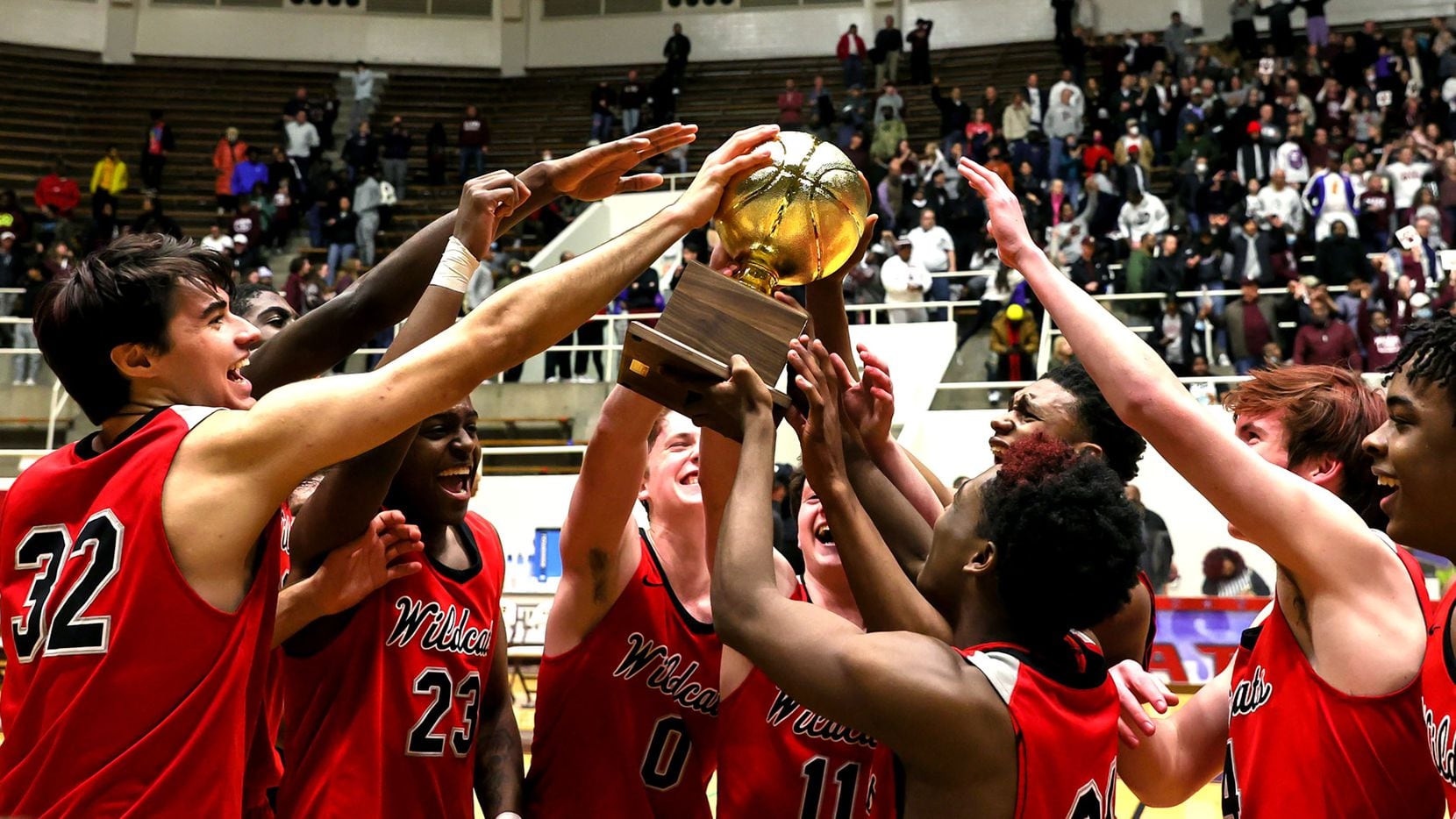 The Lake Highlands Wildcats celebrate their victory over Plano, 58-56 during in he 6A Region...