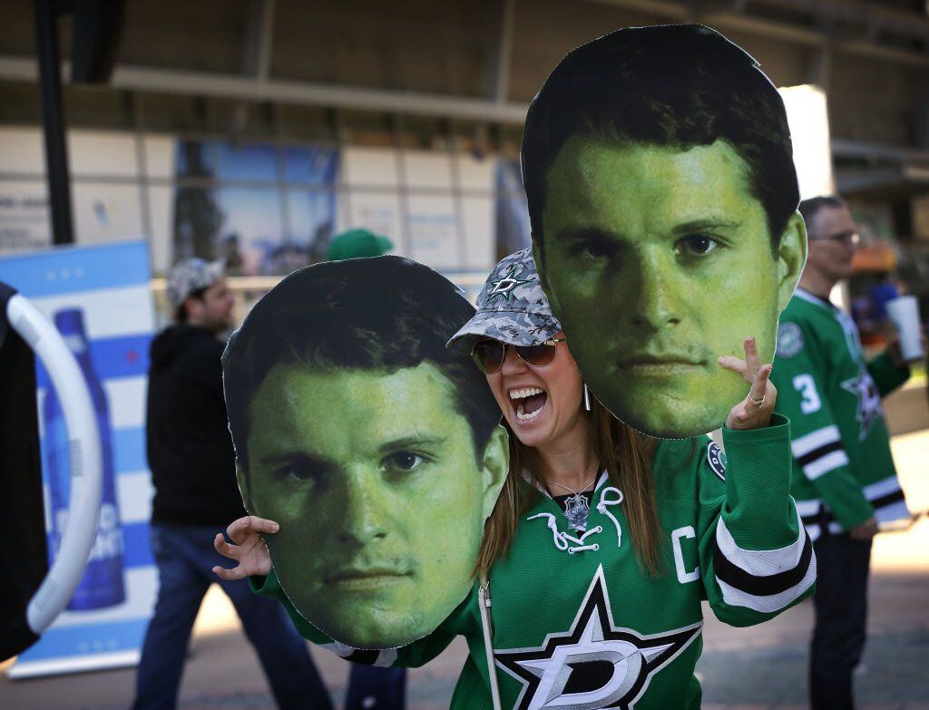 Dallas Stars fan Shannon Walker of Lewisville poses for selfies with photos of Dallas Stars...